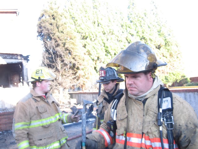 Firefighter Rob McCabe getting dirty in someone else's gear.